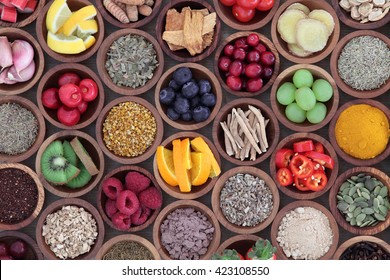 Health and super food  to boost immune system in wooden bowls, high in antioxidants, anthocyanins, minerals and vitamins. Also good for cold and flu remedy.