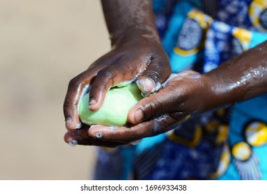 Health Symbol when African Girl Washes Her Hands Strongly with Soap and Sanitizer to avoid contacting Virus
