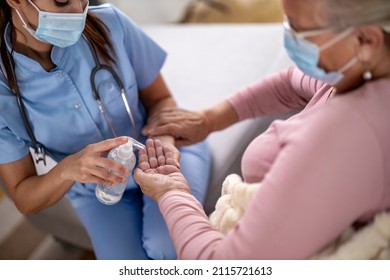 Health Visitor And Senior Woman During Home Visit.