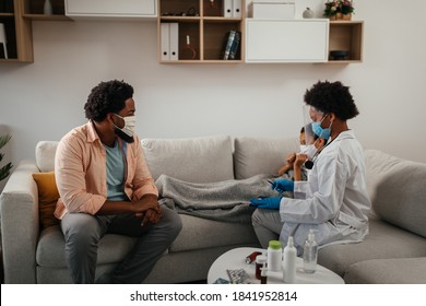 Health Visitor, Young Boy And His Father During Home Visit