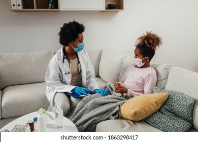 Health Visitor And A Young Girl During Home Visit