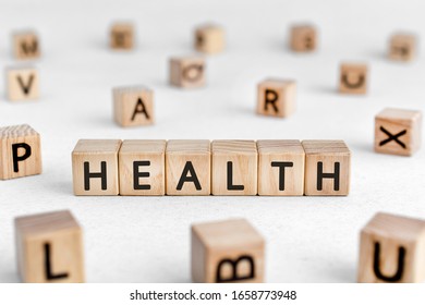 Health - words from wooden blocks with letters, the state of being free from illness or injury health concept, white background - Shutterstock ID 1658773948