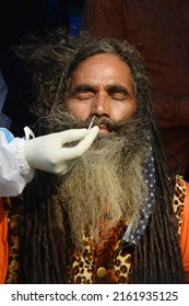 Health Worker Collects Swab Sample Of Sadhu For COVID 19 Testing At Gangasagar Transit Camp Amid Concern Over Spread  Of COVID 19 On January 7,2022 In Calcutta, India. 