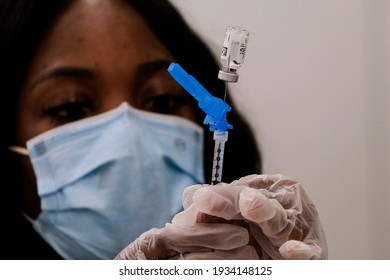 A Health Worker Prepares A Syringe With The New One-shot Johnson And Johnson COVID-19 Vaccine At A Vaccination Event At Baldwin Hills Crenshaw Plaza In Los Angeles On March 11, 2021. 