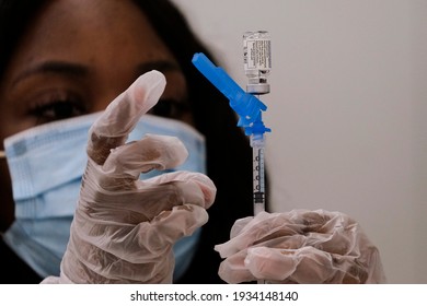 A Health Worker Prepares A Syringe With The New One-shot Johnson And Johnson COVID-19 Vaccine At A Vaccination Event At Baldwin Hills Crenshaw Plaza In Los Angeles On March 11, 2021. 