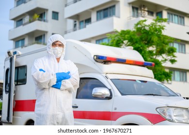 Health Workers In Emergency Ambulances Wear PPE Clothing And Face Masks. Hospital Exit, Outpatient Quarantine Tent, Intensive Care Center In COVID-19 Hospital