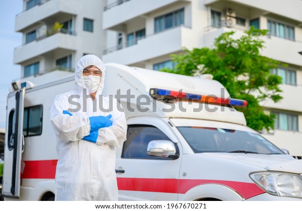 Health workers in emergency ambulances\
wear PPE clothing and face masks. Hospital Exit, Outpatient\
Quarantine Tent, Intensive Care Center in COVID-19\
Hospital