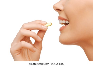 Healthcare And Beauty Concept - Beautiful Woman With Omega 3 Vitamins