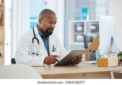 Healthcare, black man and doctor with clipboard, report and information for procedure, schedule and details. African American male employee, surgeon or medical professional with documents or feedback - Powered by Shutterstock