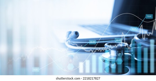 Healthcare business concept. Stethoscope and laptop cpmputer with medical financial graph growth chart, data analysis, Health business finance and investment - Powered by Shutterstock