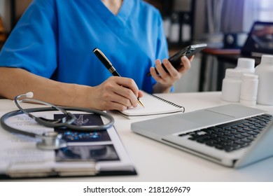 Healthcare Business Graph And Medical Examination And Businessman Analyzing Data And Growth Chart On Smartphone Laptop Background
