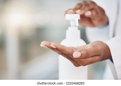 Healthcare, cleaning and covid rules at hospital by doctor disinfect hands with hand sanitizer. Compliance, safety and corona control by health expert closeup of good hygiene in fresh clean workspace - Powered by Shutterstock