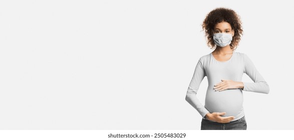 Healthcare concept. Afro pregnant woman in protective mask against flu and viruses, white background - Powered by Shutterstock