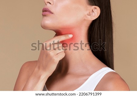 Healthcare concept. Closeup of unrecognizable sick lady suffering from sore throat, touching neck with hand, inflamed red zone, banner, cropped
