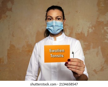 Healthcare Concept Meaning Swollen Tonsils With Inscription On The Piece Of Paper.
