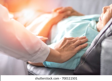 Healthcare concept of professional psychologist doctor consulting and comforting elderly patient in psychotherapy session or counsel diagnosis health. - Powered by Shutterstock