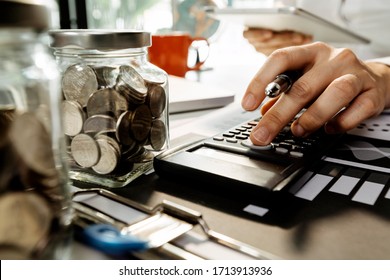 Healthcare costs and fees concept.Hand of smart doctor used a calculator for medical costs in modern hospital - Shutterstock ID 1713913936