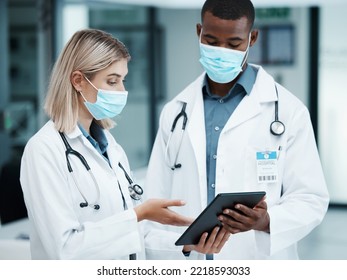 Healthcare, Covid And Doctors Checking Tablet For Medical Data, Patient Chart Or Insurance Documents In Hospital Lobby. Face Mask, Man And Woman Working In Medicine Consulting Internet Before Surgery