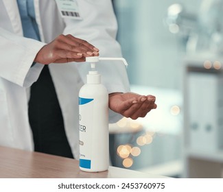 Healthcare, doctor and hand sanitizer for virus safety, protection and prevention in hospital. Professional, desk and physician with washing and bacteria risk in a clinic with pathology expert - Powered by Shutterstock