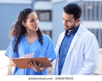 Healthcare, doctor and nurse with clipboard outdoor for medical chart, information or planning procedure. Team, medicine and health professionals with documents for diagnosis, discussion or support - Powered by Shutterstock