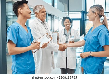 Healthcare, doctor and nurse handshake in a hospital to welcome or celebrate success. Men and women medical group together for teamwork and shaking hands for collaboration with trust and support - Powered by Shutterstock