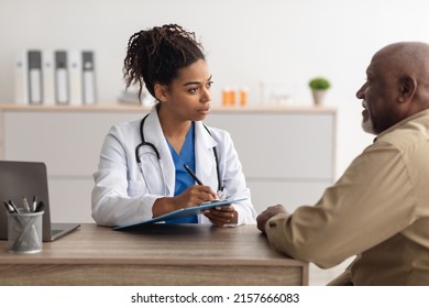 Healthcare, Geriatric Medicine, Medical Check Up. Senior man visiting doctor tell about health complaints, female gp writing personal information, filling form attentively listening to elderly patient - Powered by Shutterstock