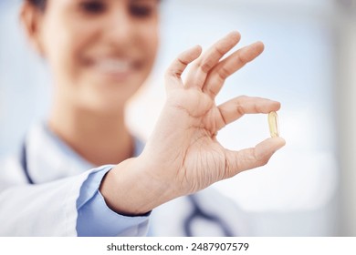 Healthcare, hand and pharmacist with pill for treatment, prescription and medication check for safety. Hospital, medical employee and inspection of capsule, nutrient and supplement for vitamin d - Powered by Shutterstock