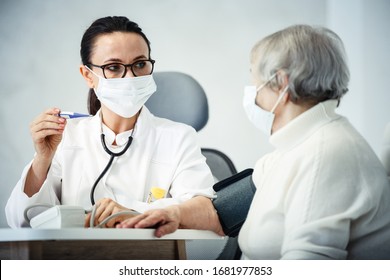 healthcare in hospital concept. female doctor consulting old lady in cabinet