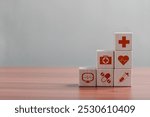 Healthcare insurance concept, Medical symbols on wooden blocks, health and access to health care, health insurance.