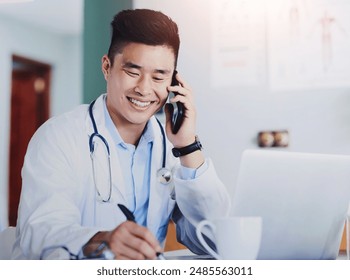 Healthcare, laptop and phone call with doctor writing in office of hospital for appointment or schedule. Computer, notepad and smile with asian medicine professional in clinic for consultation - Powered by Shutterstock