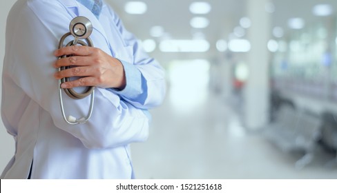 Healthcare  and medical concept. Medical doctor holding stethoscope in hospital background.