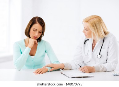 Healthcare And Medical Concept - Doctor With Patient In Hospital