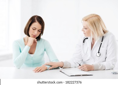 Healthcare And Medical Concept - Doctor With Patient In Hospital