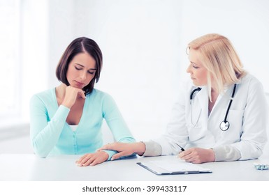 Healthcare And Medical Concept - Doctor With Patient In Hospital