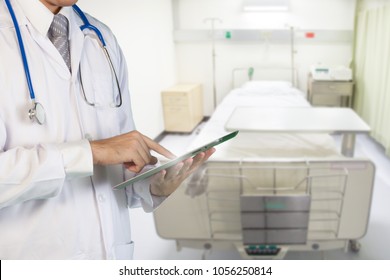 Healthcare And Medical Concept, Doctor Use Touchscreen With Technology For Patient Treatment And Medical Record In A Hospital.