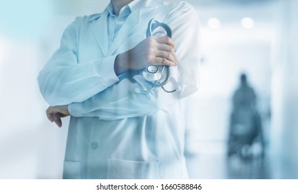 Healthcare And Medical Concept. Medicine Doctor With Stethoscope In Hand And Patients Come To The Hospital Background.
