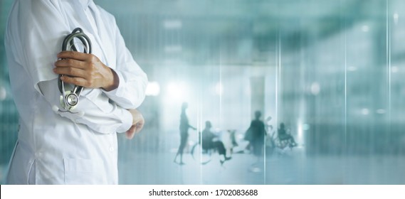 Healthcare and medical concept. Medicine doctor with stethoscope in hand and Patients come to the hospital background. - Shutterstock ID 1702083688