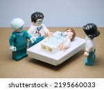 Healthcare and medical conceptual design. Lego, bricks, roblox and toy photography concept with mini figure. Background is blurred.