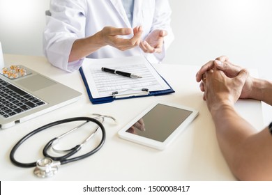 Healthcare And Medical Ethics Concept, Doctor Explains Prescription To Victim Diagnosis  Giving A Consultation And Patient Listening Intently In Hospital