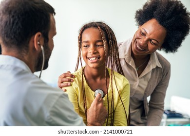 Healthcare Medical Exam People Child Concept. Close Up Of Happy Girl And Doctor With Stethoscope
