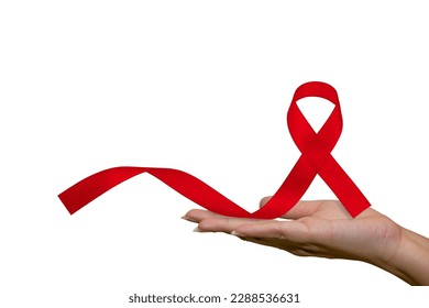 Healthcare and medical, female hand holding red AIDS awareness ribbon. Help red ribbon in support of women's hands for World AIDS Day and National HIV-AIDS Month concept and aging awareness