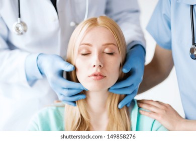 healthcare, medical and plastic surgery concept - plastic surgeon or doctor with patient