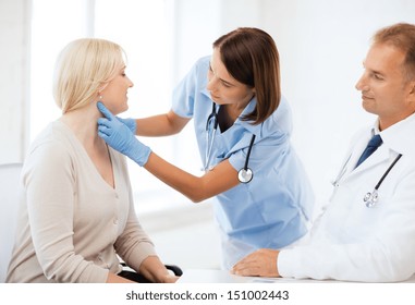 Healthcare, Medical And Plastic Surgery Concept - Plastic Surgeon Or Doctor With Patient