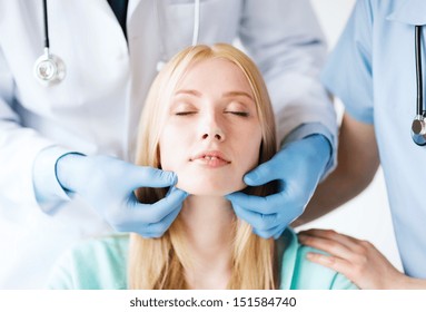 Healthcare, Medical And Plastic Surgery Concept - Plastic Surgeon Or Doctor With Patient