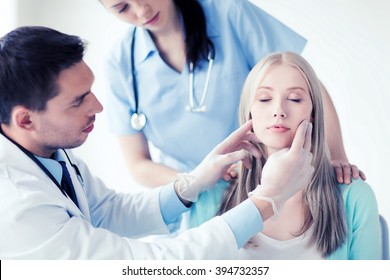 Healthcare, Medical And Plastic Surgery Concept - Plastic Surgeon Or Doctor With Patient