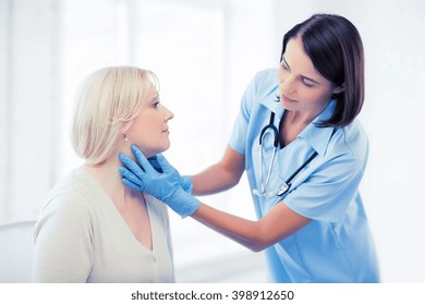 Healthcare, Medical And Plastic Surgery Concept - Plastic Surgeon Or Doctor With Patient