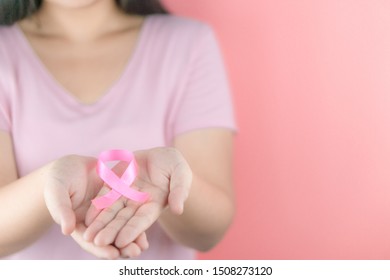 Healthcare, medicine and breast cancer awareness concept. Closeup woman hands holding pink breast cancer awareness ribbon. - Shutterstock ID 1508273120
