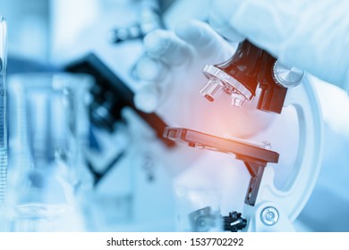 Healthcare And Medicine Concept, Close Up Scientist Using Microscope In Laboratory Room While Making Medical Testing And Research