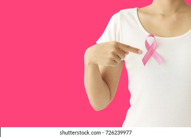 healthcare and medicine concept. Woman hand holding pink breast cancer awareness ribbon. - Shutterstock ID 726239977