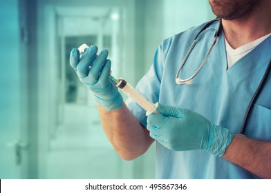 Healthcare And Medicine. Doctor with syringe is preparing for injection